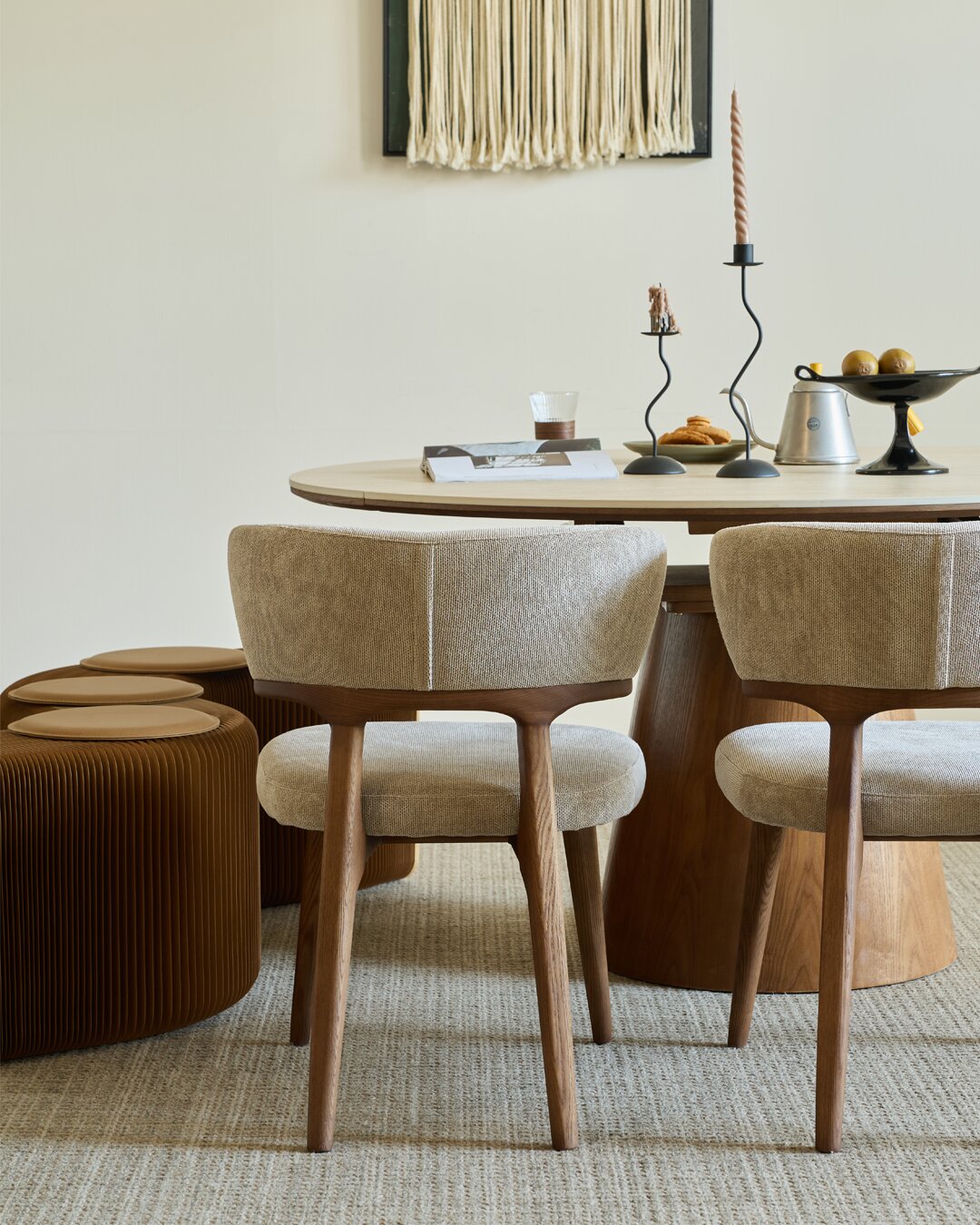 Two Barcia chairs seen from behind, showing the sculpted back support