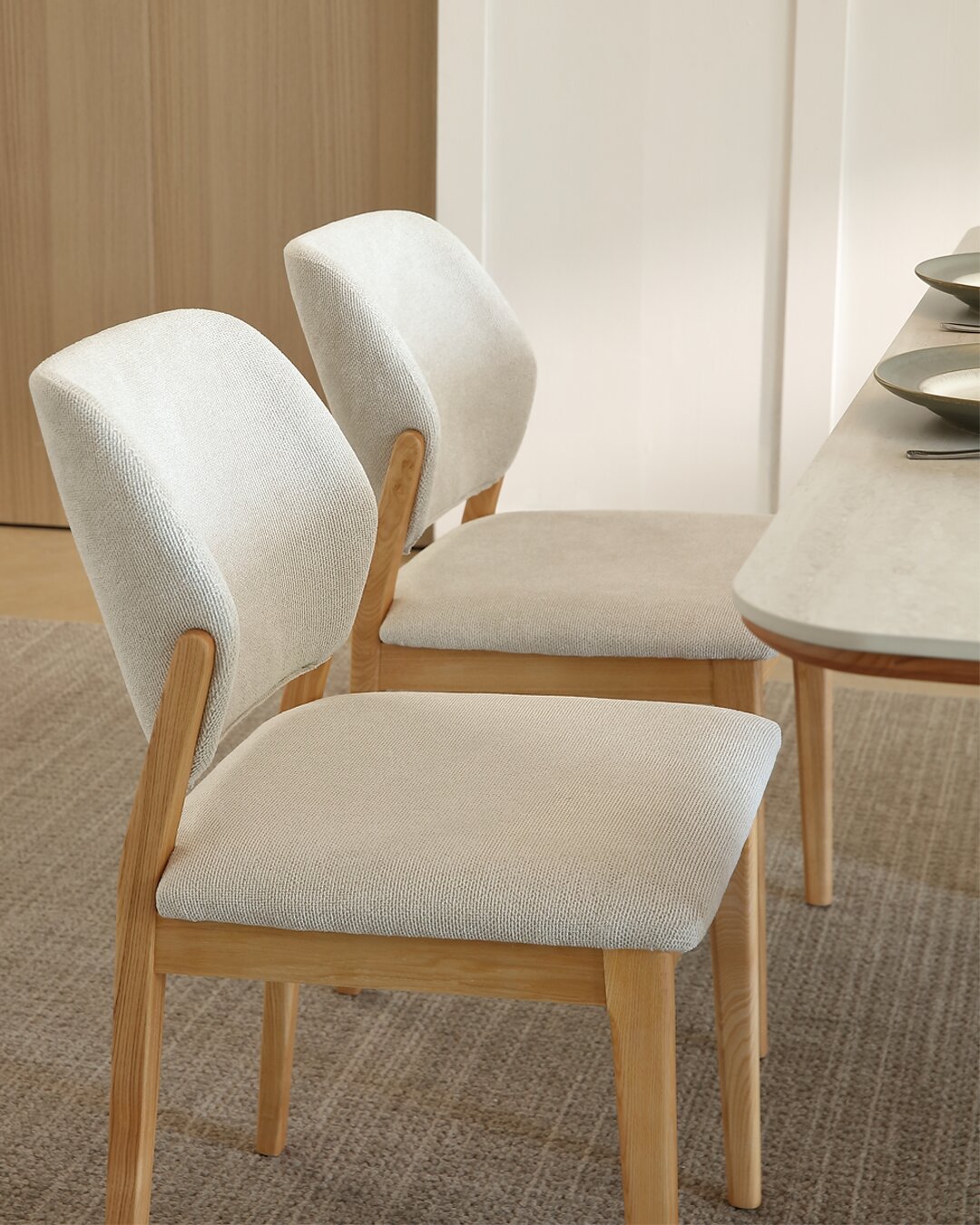 Two Bianca chairs pulled up to a table