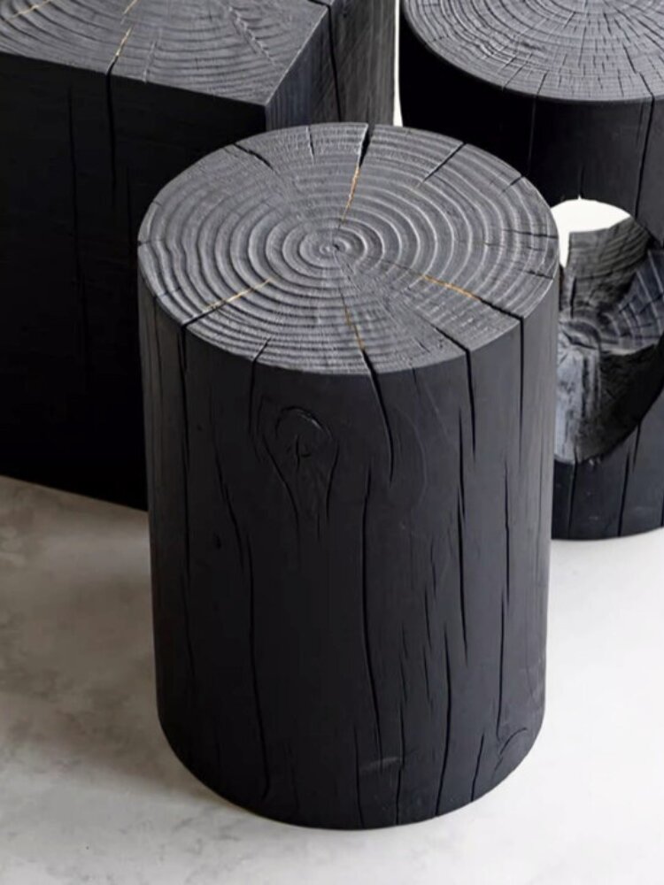 The Leon stool, a solid timber stump finished black