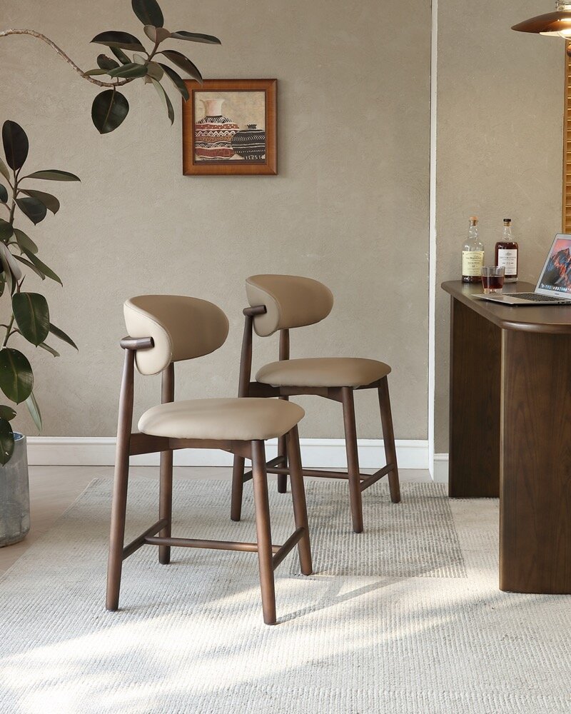 A pair of Lucia Plus chairs at the bar