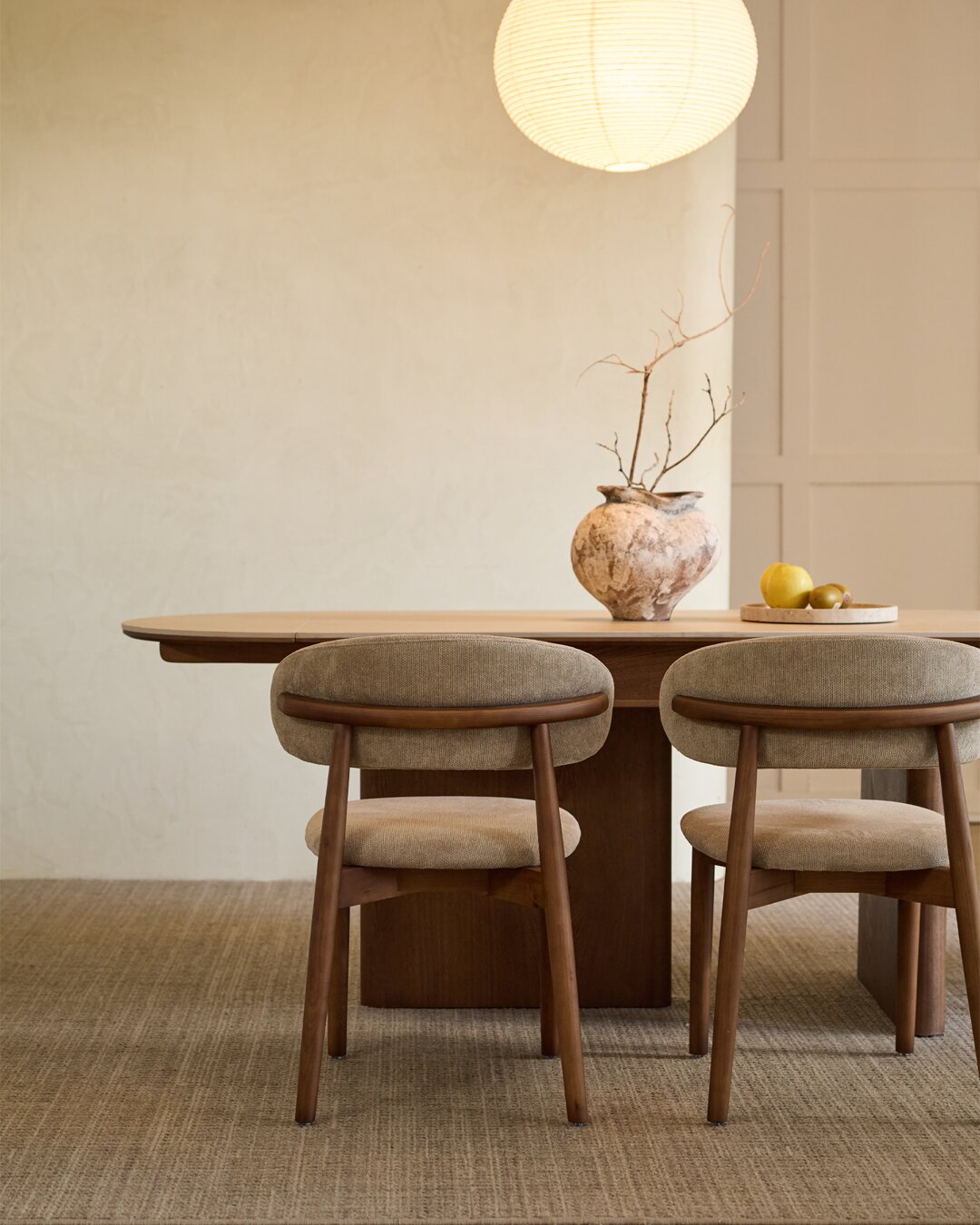 Two Lucia chairs seen from behind, showing the rail behind the backrest