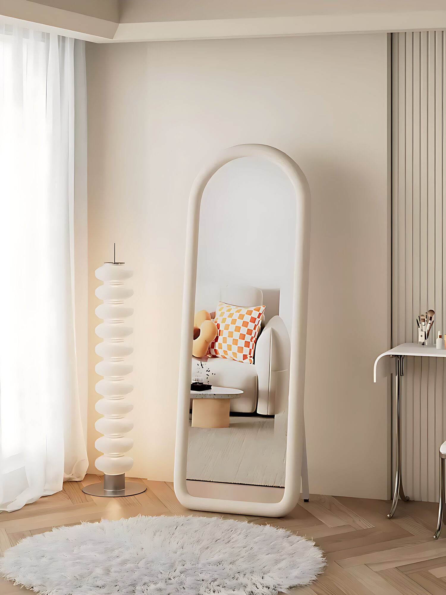The Tina mirror standing in the bedroom, its arched suede frame in white